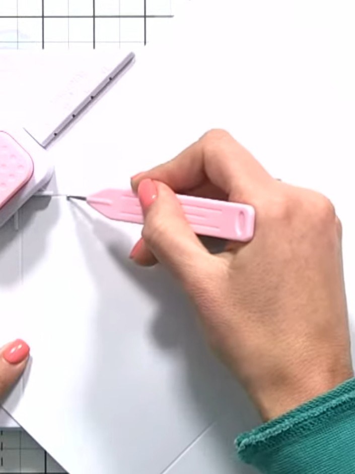 Step 5: Twist the envelope and box tool to rotate the paper and line it back up with the XL diagonal line on the tool.