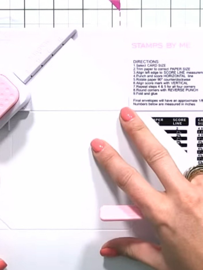 Step 9: Line up each corner triangle with the envelope and box tool and punch out the hook-and-eye connectors on all f