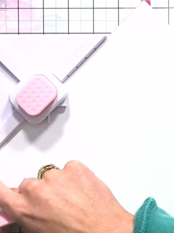 Step 2: Insert the white cardstock into the box and envelope maker tool, aligning it with score line 4. Use the scorin