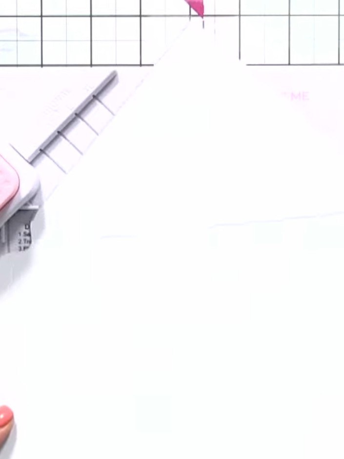 Step 4: Line up the envelope template with the horizontal score line on the paper. Punch the first score line using th