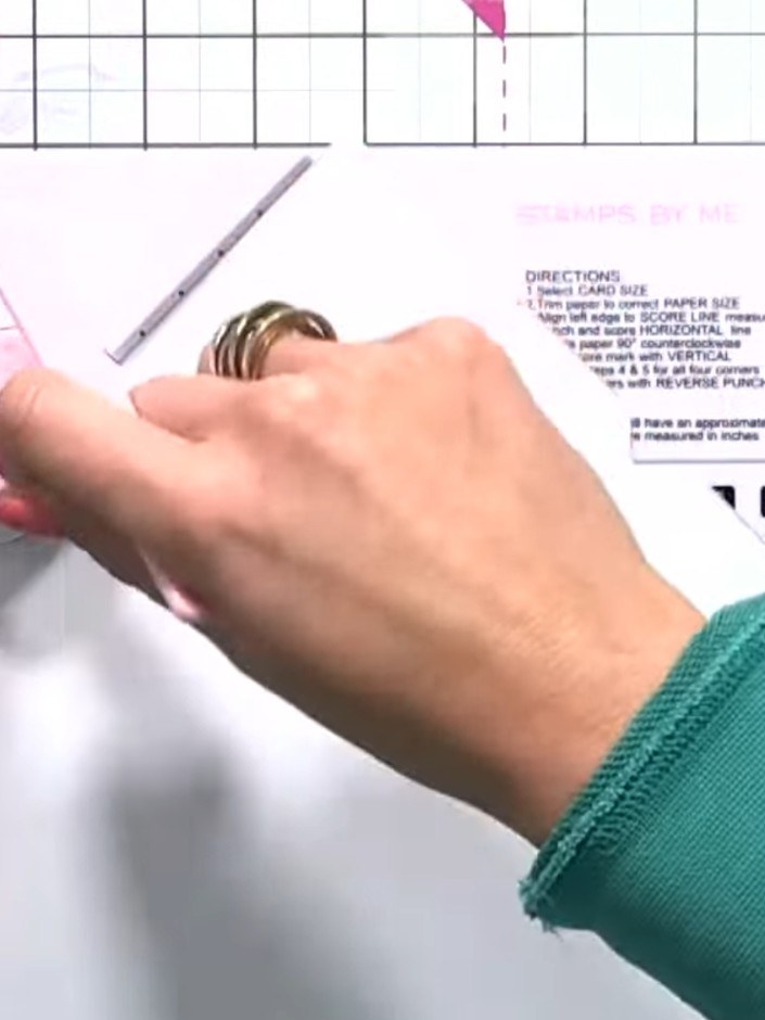 Step 6: Score across the paper using the box maker tool and punch the corners. The score lines will help create the en