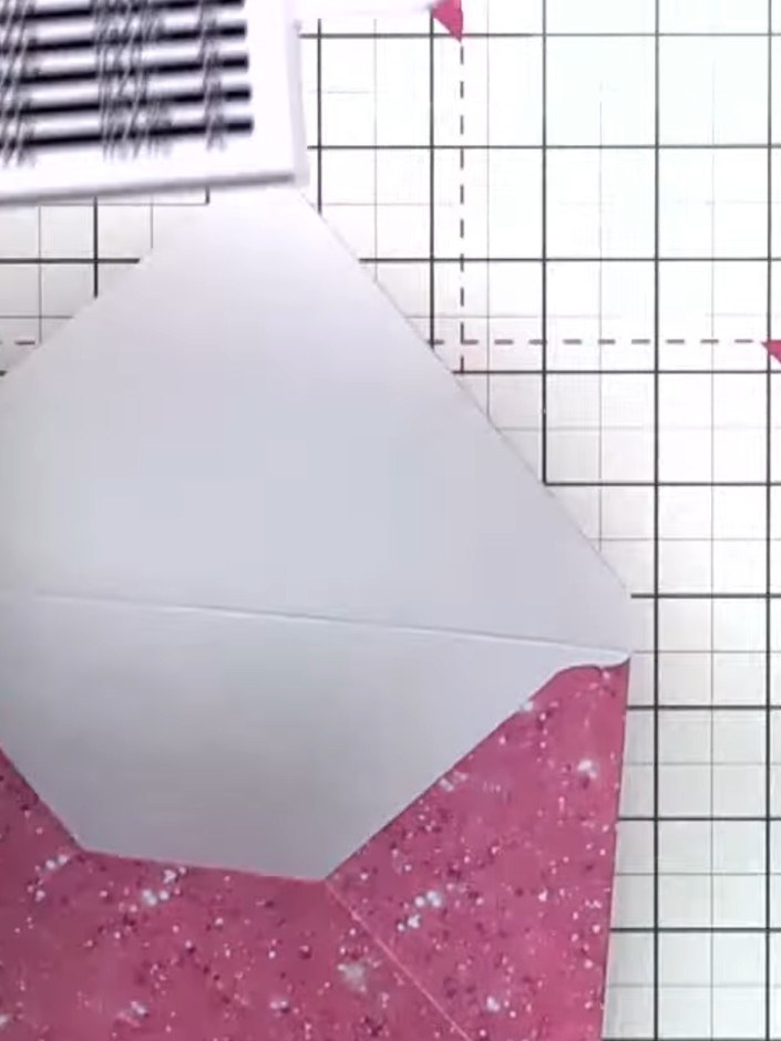 Step 9: Tuck in the small tail at the top of the envelope for a neater finish.
