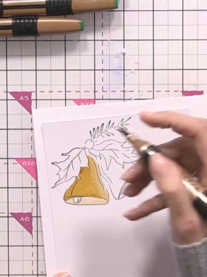 Step 6: Apply the darkest yellow marker to the remaining uncoloured area of the bell. Blend the colour smoothly with t