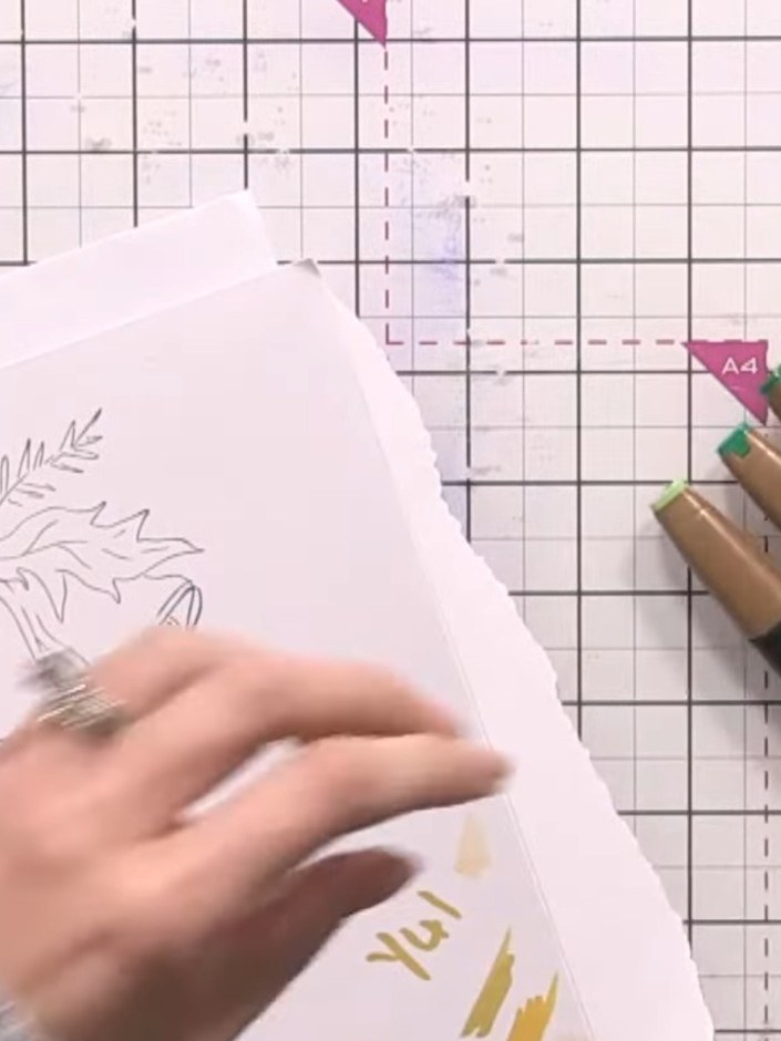 Step 8: Select three shades of green marker. Begin colouring the leaves on your stamped image, applying the lightest g