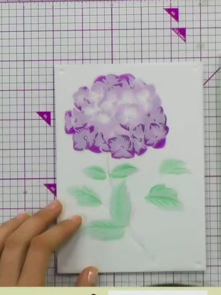 Step 10: Once the stencilled design is completely dry, use the coordinating die to cut out the hydrangea flower, or lea