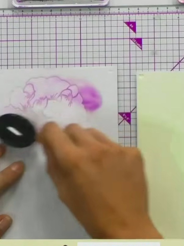 Step 2: Apply purple ink through the stencil using a light hand and a blending tool. Work the ink gently over the sten