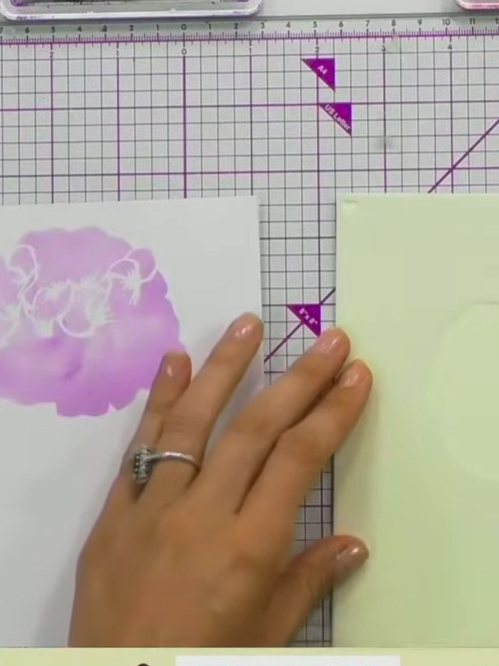 Step 5: Apply a slightly darker shade of purple or press harder with the same colour to build dimension on the flower.