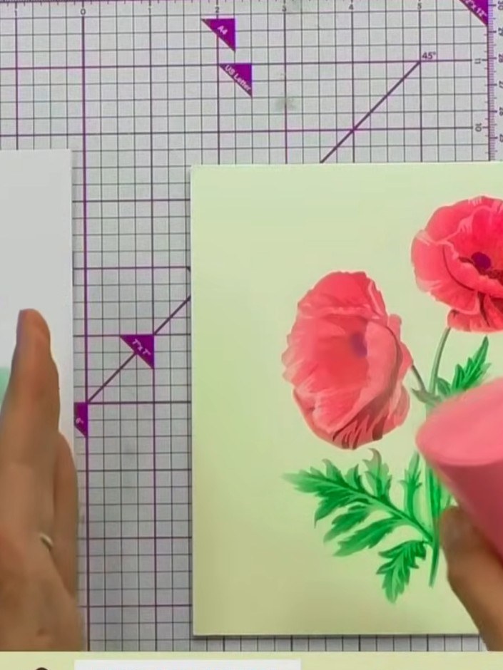 Step 9: If the ink has bled or lost detail, reposition the final poppy stencil layer over the flowers and reapply red 