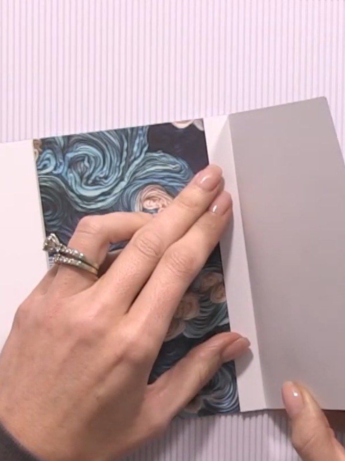 Step 5: Take another scored sheet and position it over the back panel of your album. Adhere it in place to create a po