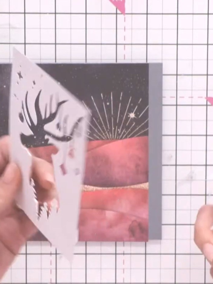 Step 5: Position the tree line stencil piece over the card using foam pads for dimension. Layer it to fill any gaps in