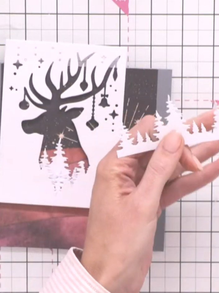 Step 7: Secure additional tree line pieces using foam pads, varying their heights to create a cascading effect across 