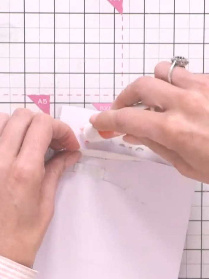 Step 8: Apply glue to the back of your decorated paper panel and mount it onto your card base, leaving a clean border 