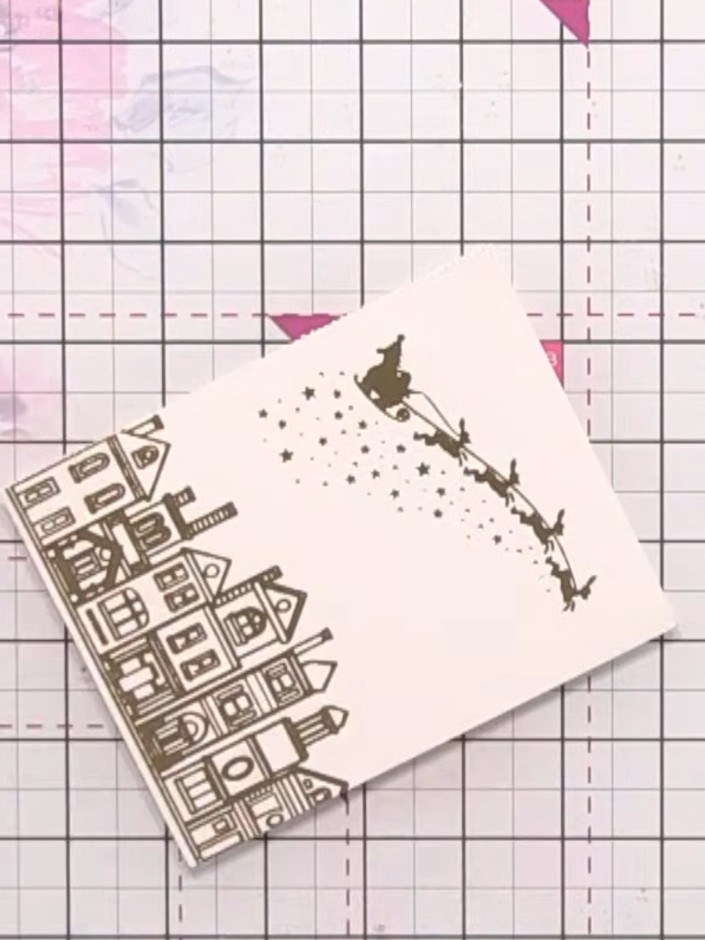 Step 1: Using a flat brush and clean water, wet the top portion of the card above the house line. Work on a slightly t