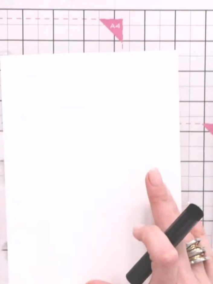 Step 2: Line up stencil number one with the edge of your watercolour card stock using the heart registration mark in t