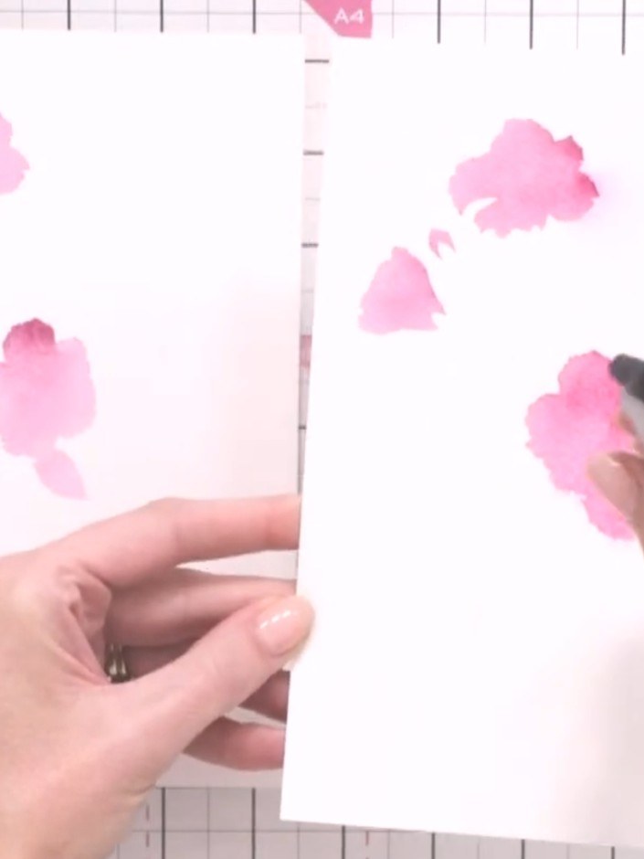 Step 6: Spray the first card with water using a spray bottle to create colour bleeding and a soft, artistic watercolou