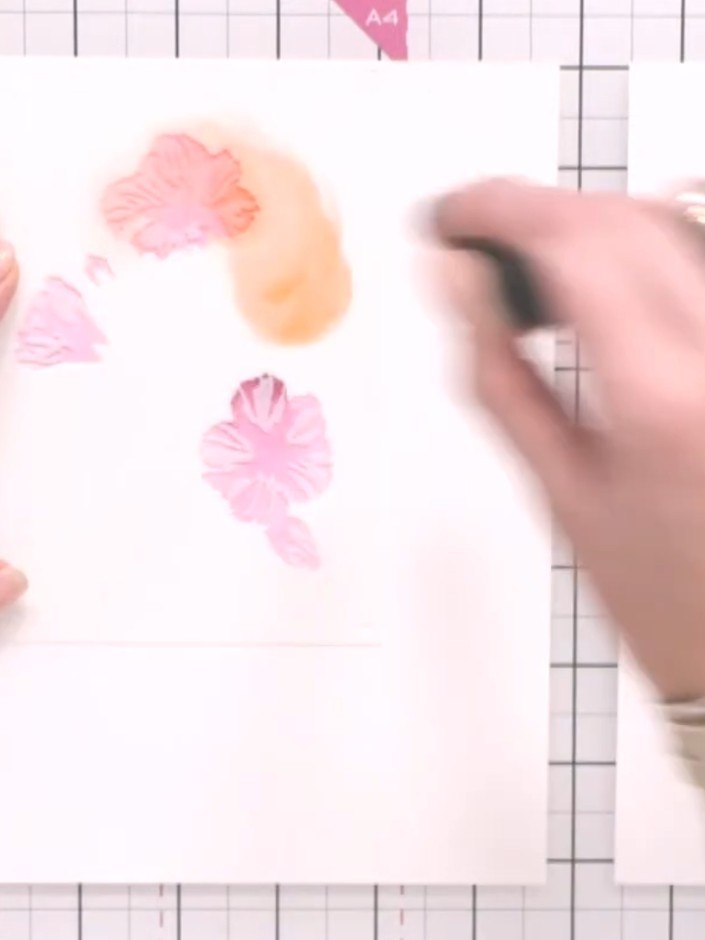 Step 8: Lightly spray the second card with water in selected areas to create controlled colour bleed. Focus on specifi
