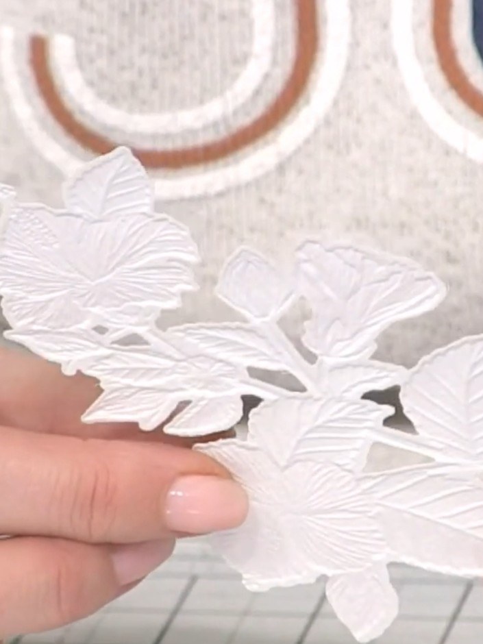 Step 10: Remove the embossed hibiscus from the machine and examine the three-dimensional detail created by the embossin