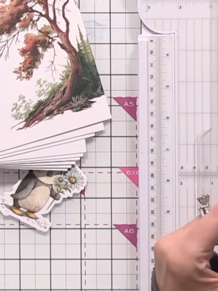 Step 11: Cut out the animal toppers from the kit using scissors or a craft knife. Trim away any excess white card aroun