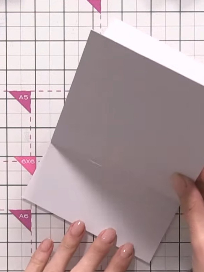 Step 3: Apply double-sided tape to the lower portion only of the grey cut front panel. Stick it to the front of your s