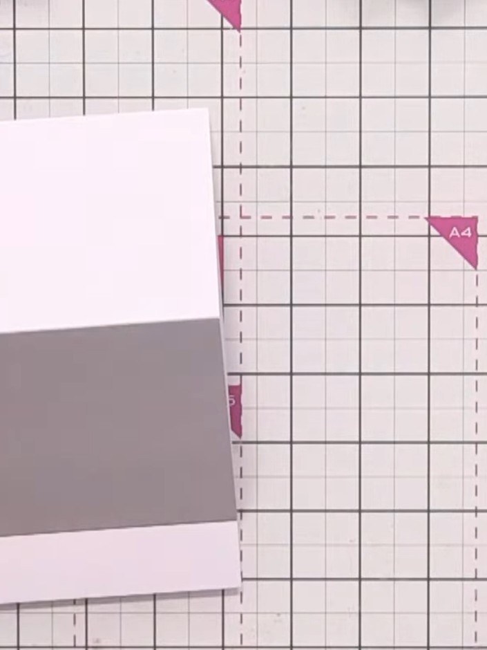 Step 4: Take one of the decorative card blanks from the kit and trim a small amount from the top and both sides to cre