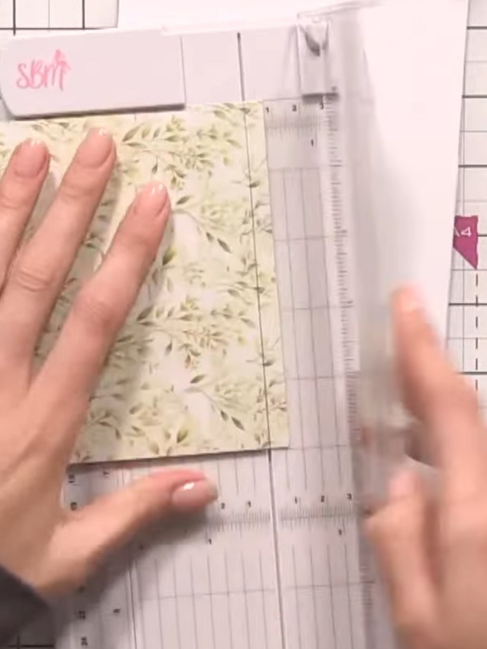 Step 7: Attach one piece of patterned paper to the top of the front panel and one to the bottom using double-sided tap