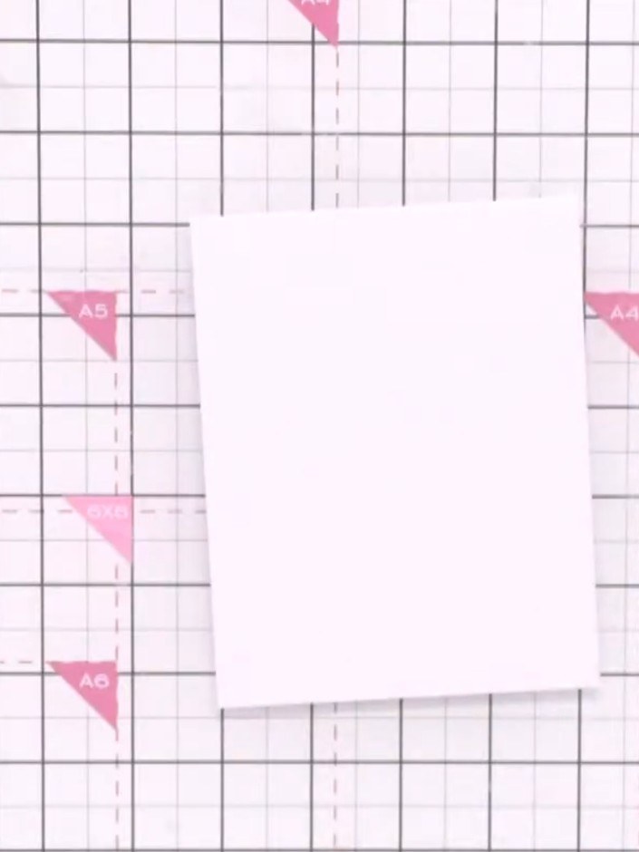 Step 1: Cut a piece of white card stock slightly smaller than your card blank to use as your working surface.