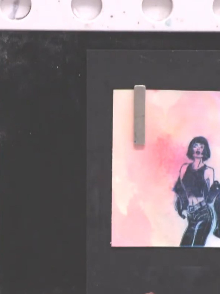 Step 11: Mount your finished watercolour lady artwork onto a black card blank using adhesive. Position it centrally in 
