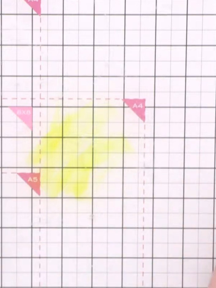 Step 2: Spray water onto your craft mat to create a wet working area. Add drops of yellow ink from the Sherbet ink pad