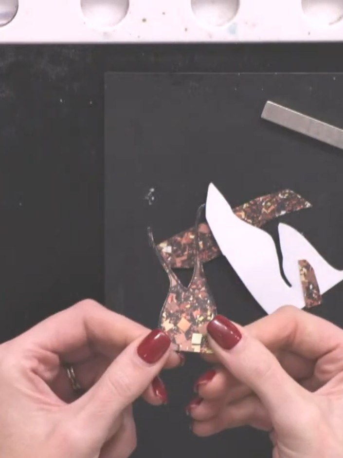 Step 6: Carefully position and glue the paper-pieced sparkly dress over the stamped lady's dress area on the white top