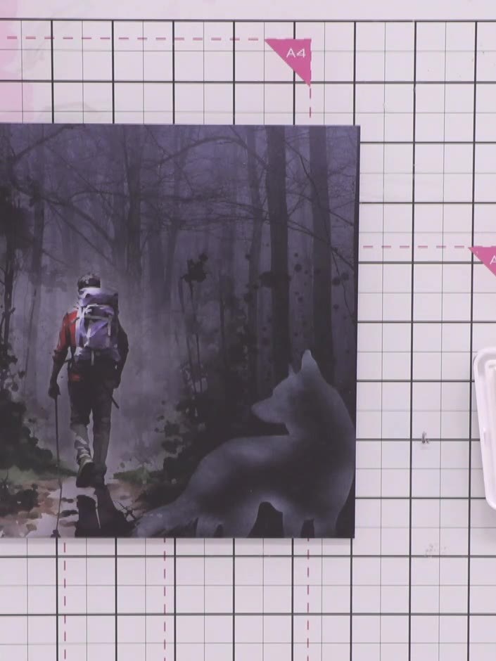 Step 5: Stamp the hiker figure onto the forest patterned paper using white ink. Position the stamp towards the centre 
