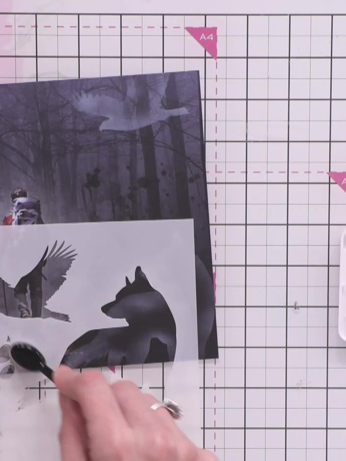 Step 8: Use the paw print stamp from the Great Outdoors stamp set to add white stamped accents across the bottom porti