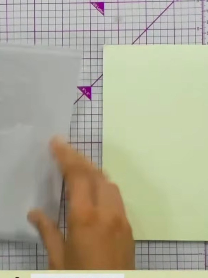 Step 1: Position the first stencil from the Poppy Bouquet layering set onto your pale green card blank, aligning it wi