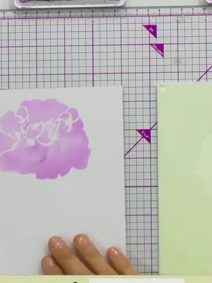 Step 4: Position stencil number 2 over your stamped image, aligning it carefully. Apply pink ink through the stencil u