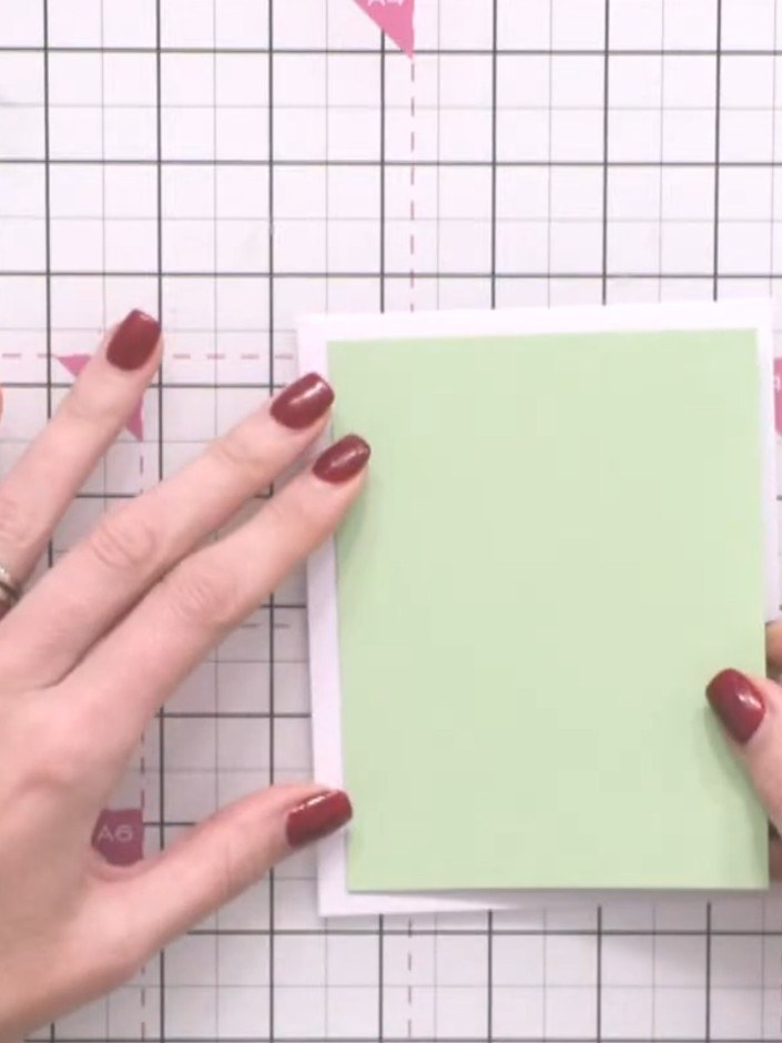 Step 1: Start with a top-folding card blank in your chosen colour. The example shown uses a green card blank.