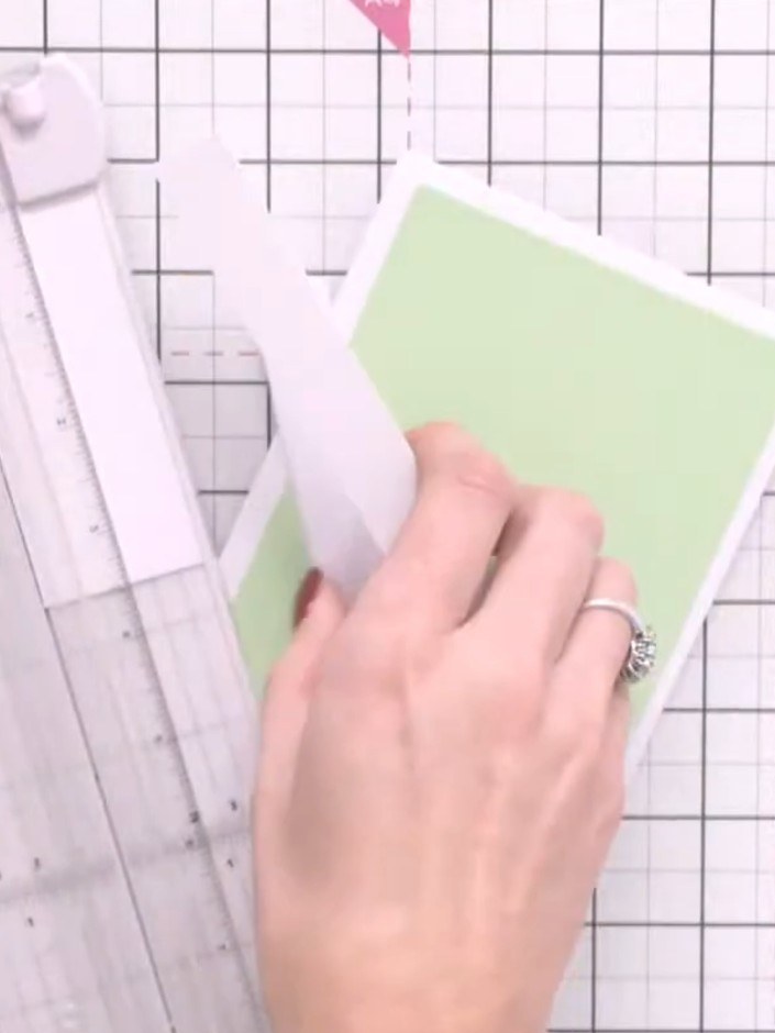 Step 2: Cut a piece of white card stock to fit as a topper layer. Mount the white card stock onto the pale green card 