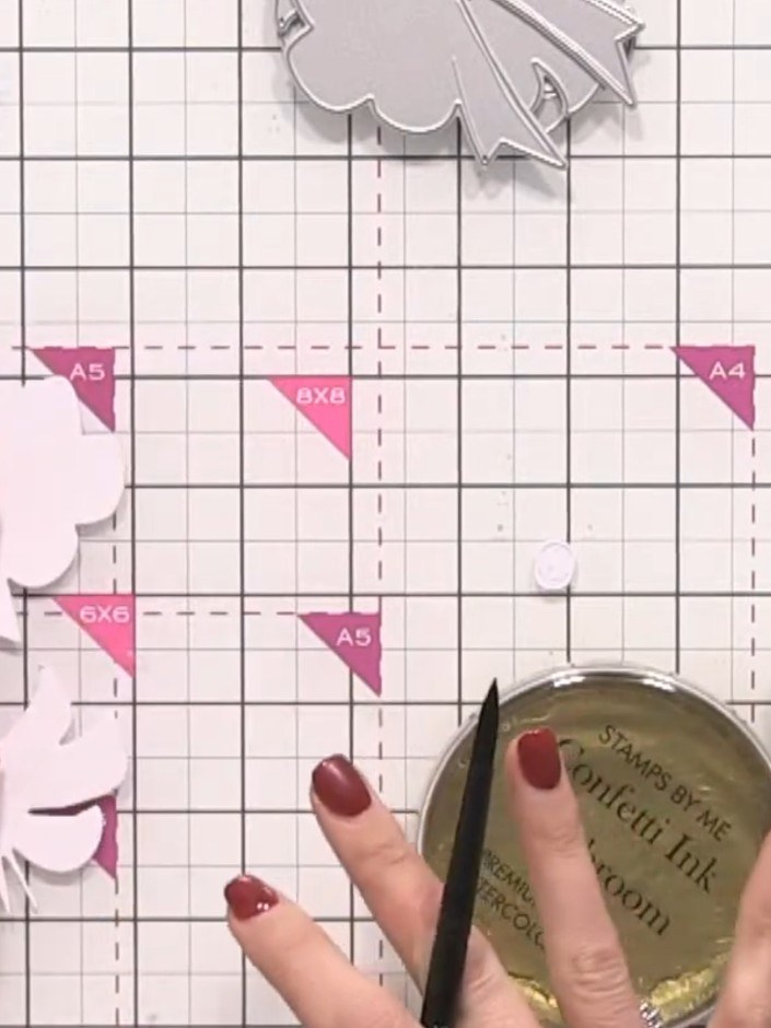 Step 4: Using a paintbrush, apply the darkest colour mixture (the iridescent pink ink) to the largest bow piece. Paint