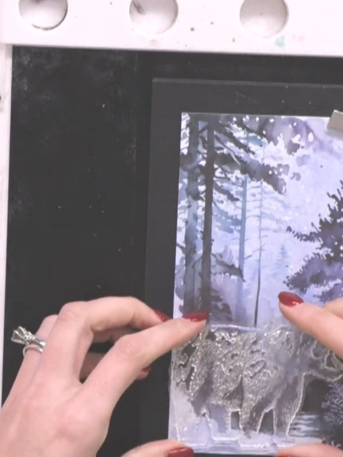 Step 2: Choose a stamp from the set, such as the bear. Ink the stamp with black ink using your stamp pad.