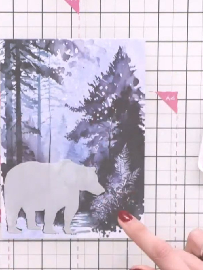 Step 4: Position the coordinating mask over the stamped bear image on your card panel, ensuring it aligns correctly to