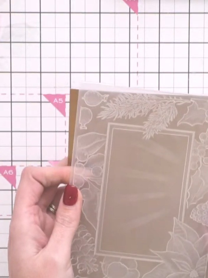 Step 2: Trim the mirror board down slightly to fit within your embossing folder. Check the size against your folder an