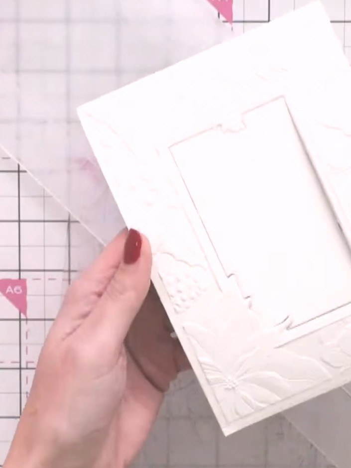 Step 5: Carefully remove the embossed mirror board from the folder. The design should now be raised on the gold mirror