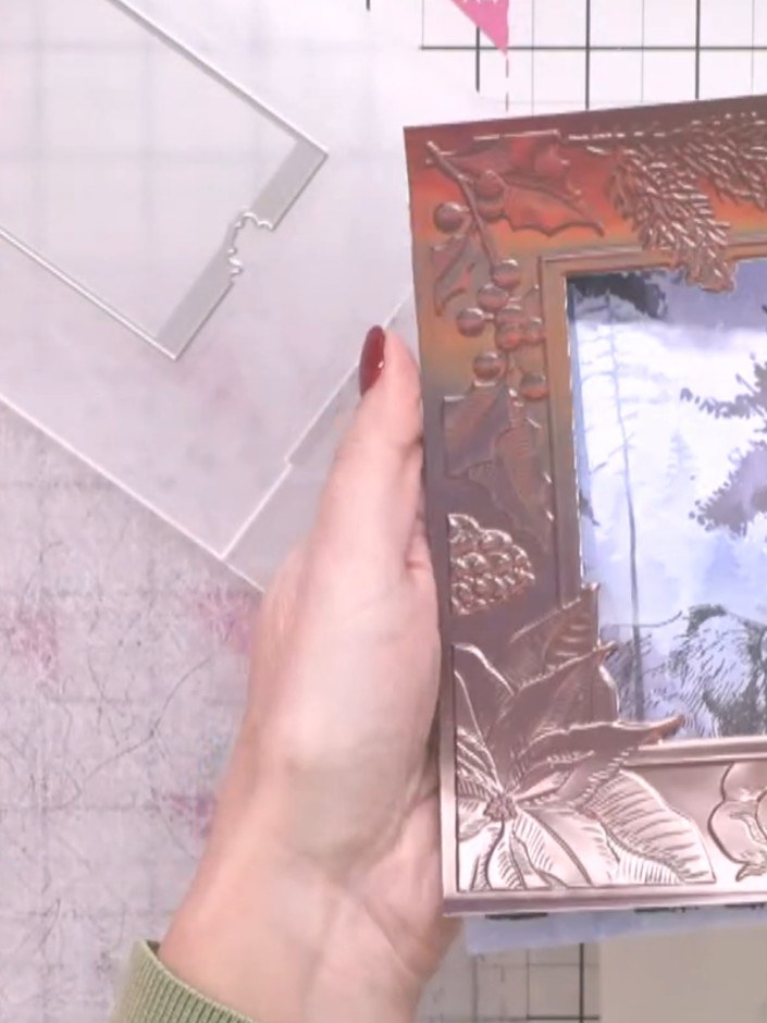 Step 6: Observe the debossed and embossed effects created by the embossing folder on the gold mirror board surface. Th