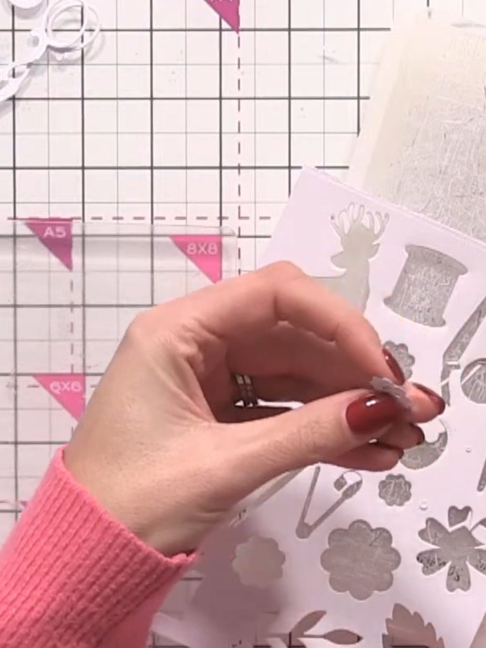 Step 3: Take the cotton spool die-cut and wrap gold thread around it to secure it and add dimension. This creates a re