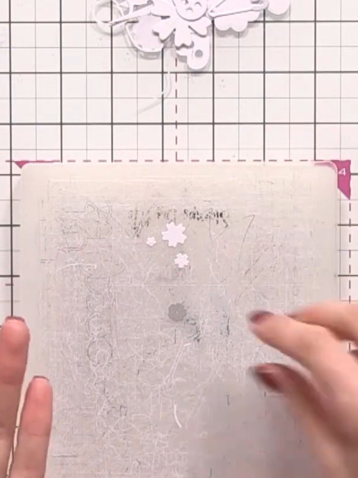 Step 7: Adhere the sewing machine die-cut to the card front using foam pads to create dimension and raise it from the 