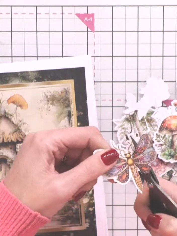 Step 10: Adhere the cut-out embellishments to the front cover of your album using foam pads for dimension. Position the