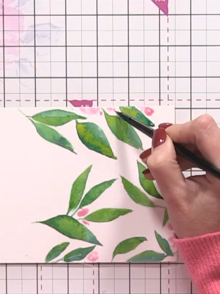 Step 8: Using a darker shade of ink, drop small amounts into the wet pink flower blobs to create dimension. Allow the 
