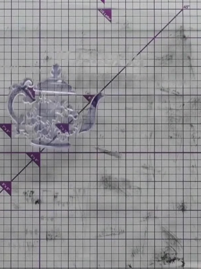 Step 3: Stamp the wet, inked teapot image onto your white card stock. Allow the stamped image to dry completely before
