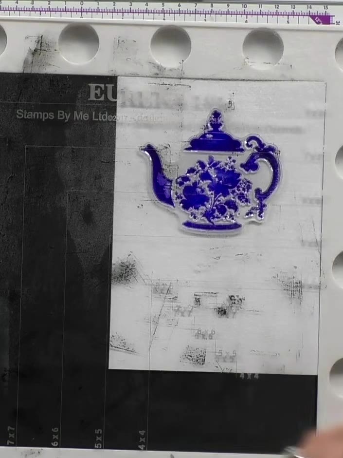 Step 5: Ink up the detail stamp portion of the teapot design using the same blue ink or a darker shade of blue ink.