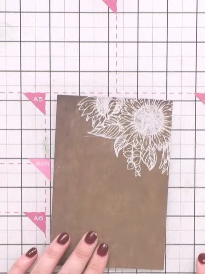 Step 3: Apply white embossing powder to the wet stamped image, ensuring the entire design is coated. Tap off any exces