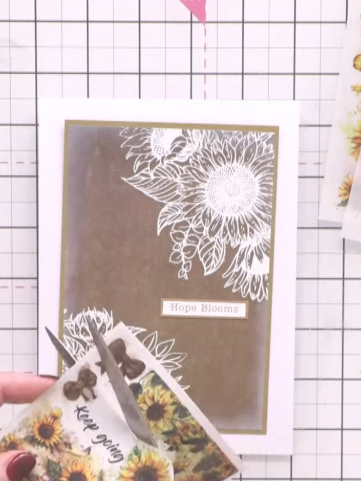 Step 6: Using cotton pigment ink, blend around the edges of the sunflower decoupage piece to create a soft, watercolou