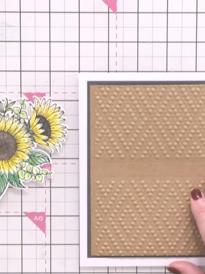 Step 1: Take a piece of craft card and run it through the embossing folder in one direction to create the embossed pat